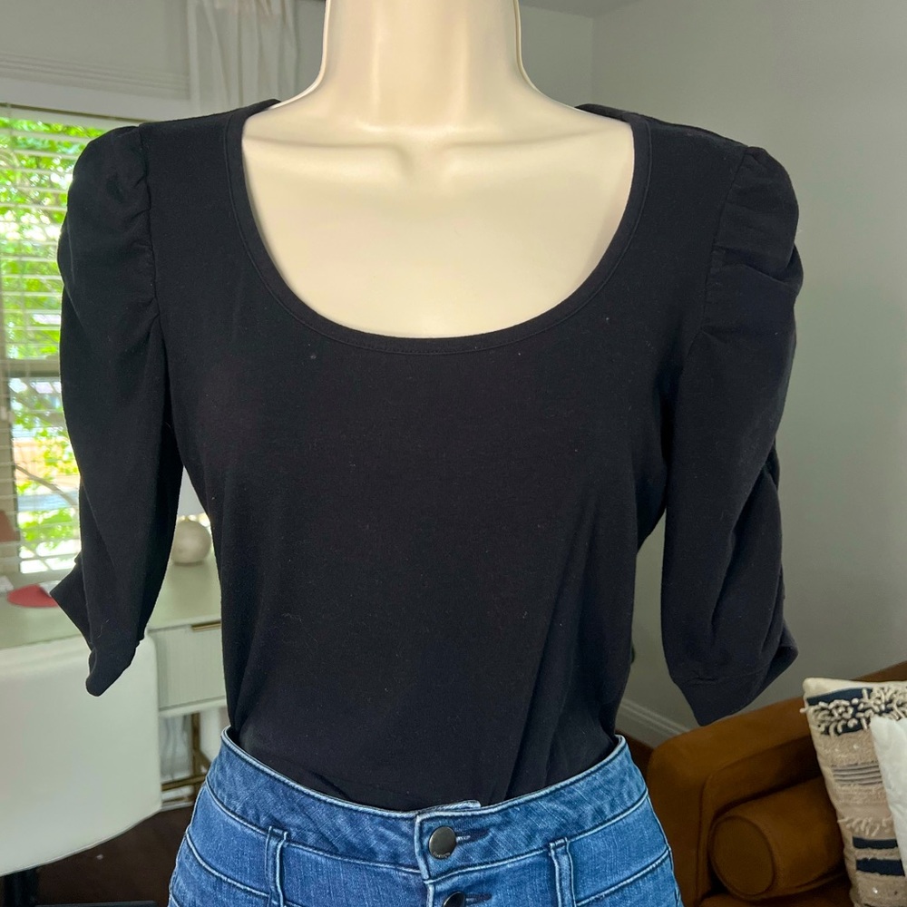 Size small black casual top with elevated shoulders and half length sleeves